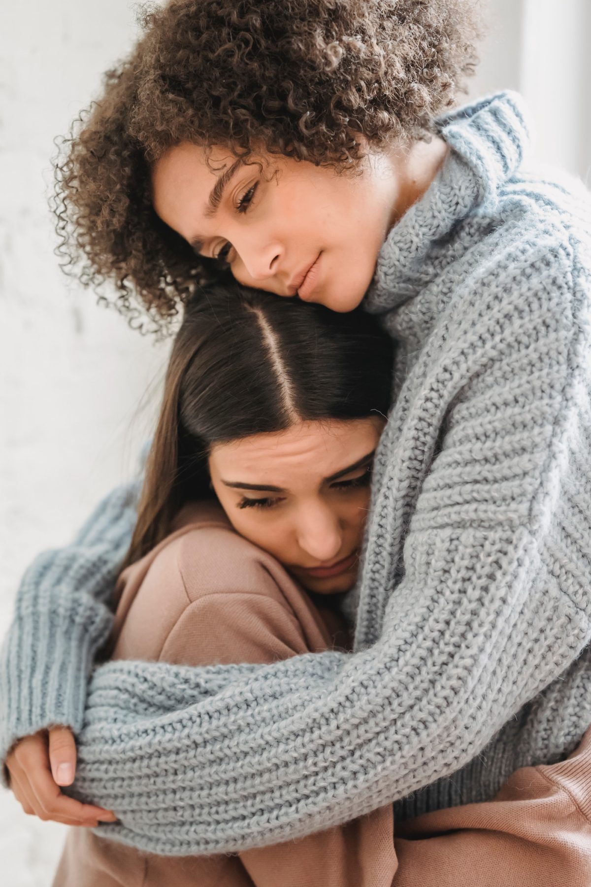 two ladies hugging for support